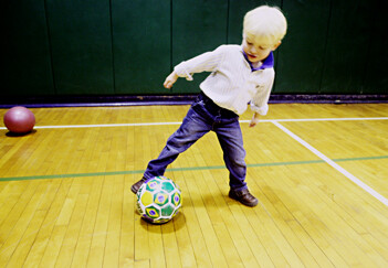 HOMEPAGE Preschool-boy-kicks-ball-gym