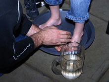 cyf_adult washes kid's feet cyf_adult washes kid's feet